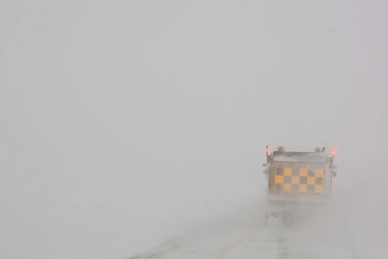 Snowplow in a blizzard on the highway, 2009
